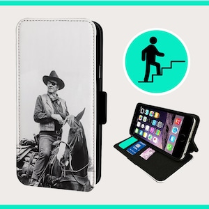 May include: A black and white photo of a man on a horse. The man is wearing a cowboy hat and a vest. The photo is printed on a white leather phone case.