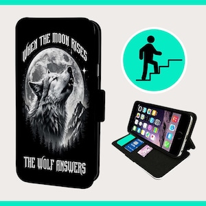 May include: Black phone case with a wolf howling at the moon. The text "When the moon rises the wolf answers" is printed on the case.