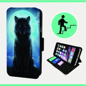 May include: A black leather phone case with a wolf howling at the moon graphic. The case has a stand feature and a flap that closes with a magnetic clasp.