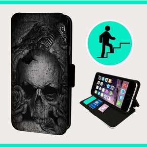 May include: Black leather phone case with a skull and roses design. The case has a stand feature and a slot for cards.