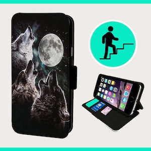 May include: A black leather phone case with a graphic of three wolves howling at the moon. The case has a stand feature and a flap that closes with a magnetic clasp.