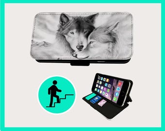 May include: A black and white phone case with a detailed illustration of two wolves. The case is open, revealing a smartphone with app icons on the screen. The case also has card slots. A round sign with a person climbing stairs is also in the image.