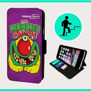 May include: A purple phone case featuring a cartoon monster. The monster is green and yellow with a red nose and a big smile. The text "MEGA MONSTER MUNCH" is above the monster. The text "PICKLED ONION flavour corn snack" is above the text "MEGA MONSTER MUNCH".