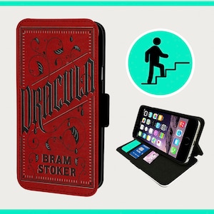 May include: A red leather phone case with a black design featuring the title "Dracula" and the author "Bram Stoker".