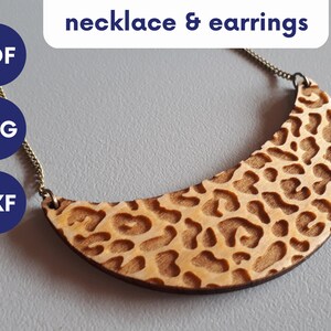 May include: A wooden necklace and earrings with a leopard print design. The necklace is a crescent shape and is on a gold chain. The earrings are not visible in the image. The image also includes text that says "PDF, SVG, DXF" in blue circles.