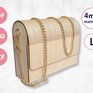 May include: A light-colored wooden box-style bag with a curved top, featuring a gold-tone metal chain strap attached to side clasps. The bag has a textured, slatted design on the upper portion and includes digital file labels for PDF, SVG, DXF, 4mm material, and L.