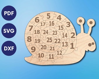 May include: A wooden snail puzzle with 25 numbered pieces. The snail is light brown and has a spiral shell with numbers 1 through 25. The snail has two eyes and a small mouth.