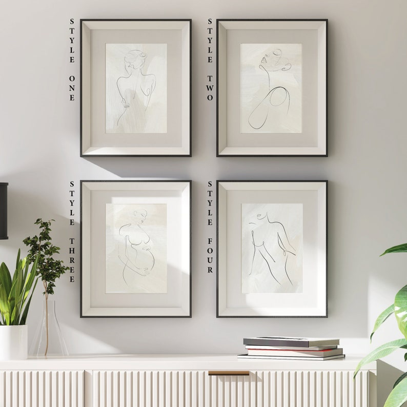 May include: Four framed minimalist line art prints of a female figure in different poses. The prints are in black and white and have a light beige background. The frames are black and have a white mat.