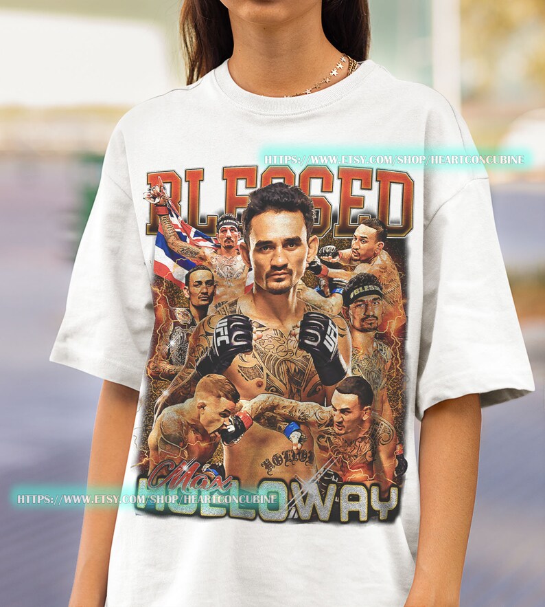 a woman wearing a white t - shirt with a photo of a wrestler on it