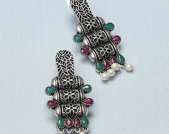 Ancienne paire de boucles d'oreilles en argent massif