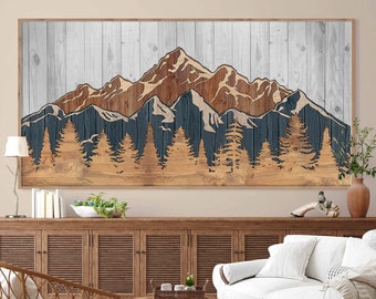 Puede incluir: Una impresión de pared de madera con una cordillera de montañas con un bosque en primer plano. Las montañas son marrones y azules, y el bosque es verde. El fondo es una veta de madera blanca.