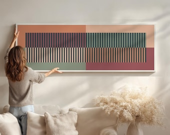 Puede incluir: Obra de arte abstracta enmarcada con diseño geométrico. La obra presenta rayas verticales en negro, beige, verde y burdeos, sobre fondos melocotón y rojo apagado. La pieza rectangular está montada en un marco blanco, ideal para interiores.