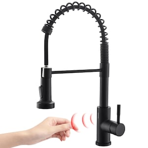 May include: Black kitchen faucet with a pull-down sprayer and a touchless sensor. The faucet has a black finish and a chrome handle. The sensor is activated by a hand waving over it.