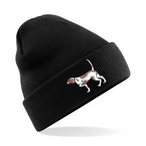 May include: Black beanie with a white embroidered image of a brown and white hunting dog.