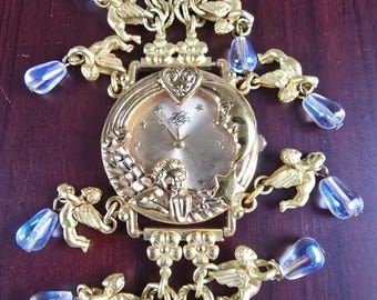 Pulsera con dije de ángel y fase lunar de Kirks Folly, estilo vintage, en caja.