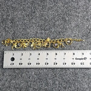 Pulsera con dije "El secreto de los siete ángeles" de Kirks Folly, estilo vintage, en caja. imagen 8