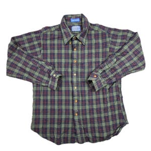 May include: A long-sleeved button-down shirt in a green, navy, and burgundy plaid pattern. The shirt has a classic collar and buttoned cuffs. The brand label is visible on the collar.