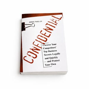 May include: A hardcover book titled "CONFIDENTIAL" with a red title and a black binder clip. The book's subtitle reads "Uncover Your Competitors' Top Business Secrets Legally and Quickly - and Protect Your Own."