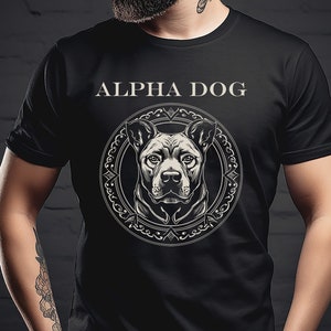 May include: Black t-shirt with a graphic of a dog's head in a circle with the text "ALPHA DOG" above it.