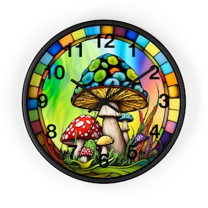 May include: A colourful clock with a psychedelic mushroom design. The clock face features a large mushroom with a blue cap and yellow gills, surrounded by smaller mushrooms with red and white spots. The clock numbers are black and the hands are black.