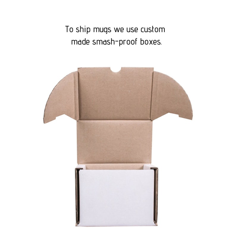 May include: A brown cardboard box with a white interior. The box is open and the top flaps are folded back. The text "To ship mugs we use custom made smash-proof boxes." is printed above the box.