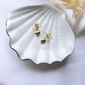 Gold bow heart stud earrings