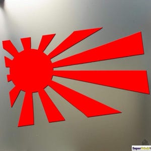 Op de afbeelding: Een rode opkomende zon grafiek met 16 stralen. De zon is een volle rode cirkel.