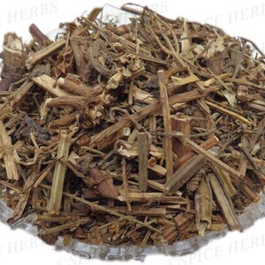 May include: A close-up of a pile of dried herbs in a clear glass bowl. The herbs are a mix of brown and green stems and leaves.