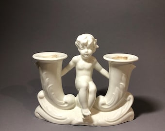 Porcelain candlestick with putto, Max Rösler 1894-1925