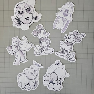May include: Black and white line drawings of various Disney characters, including Mickey Mouse, Minnie Mouse, Goofy, Dumbo, and Nemo. The drawings are on a white background.
