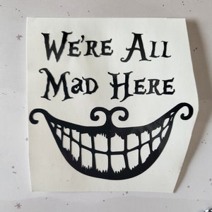 Naklejka We're All Mad Here | Naklejka Cheshire Cat | Naklejka Alicja w Krainie Czarów