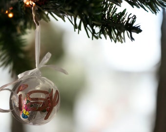 Personalised Christmas bauble with various sweets inside . 60mm