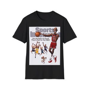 May include: Black t-shirt with a graphic of a basketball player holding a basketball and the text "Sports Illustrated" and "Are the Bulls So Good They're Bad for the NBA?"