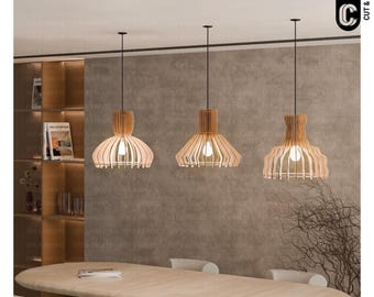 May include: Three wooden pendant lights with a natural wood finish hang from a black wire. The lights are in a modern style and have a geometric design. The lights are hanging over a wooden table.