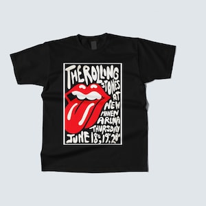 May include: Black t-shirt featuring a white rectangular design with the words "THE ROLLING STONES" and a red tongue logo. The text below reads "AT NEW HAVEN ARENA THURSDAY JUNE 18, 19, 20".