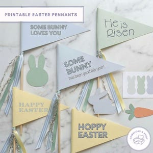 May include: Pastel-coloured printable Easter pennants with phrases such as "Some Bunny Loves You" and "Happy Easter". The image includes bunny cutouts, ribbons, and a carrot. The text "He is Risen" is also visible.
