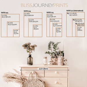 May include: A white wall with a wooden dresser with a light wood finish. The dresser has five drawers and is decorated with dried flowers and a wicker basket. The wall has a chart with different print sizes and ratios in inches and centimeters. The chart includes the following sizes: 4x5, 3x4, 2x3, and 5x7. The chart also includes the following international paper sizes: A3, A4, and A5.