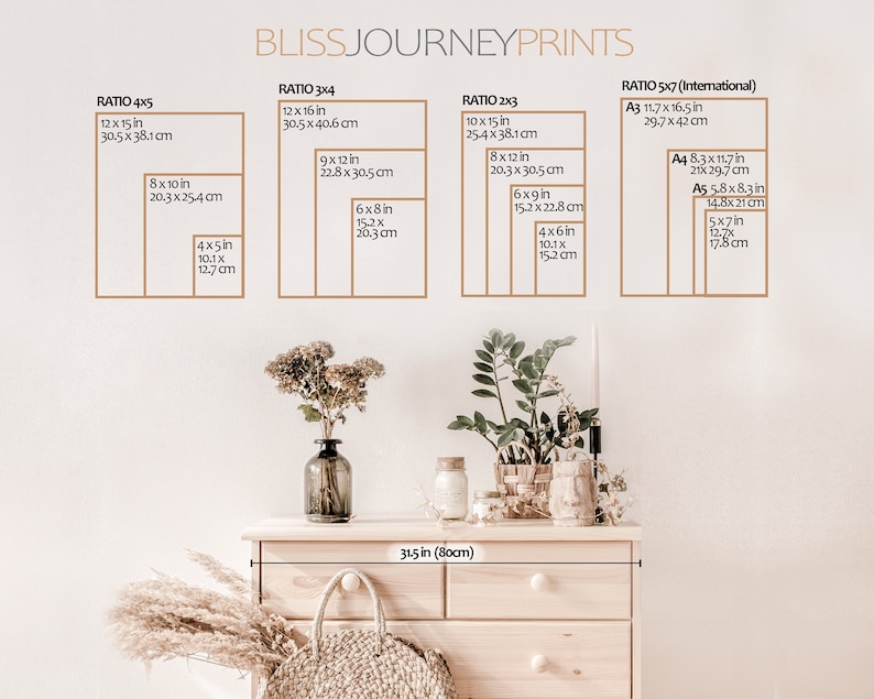 May include: A white wall with a wooden dresser with a light wood finish. The dresser has five drawers and is decorated with dried flowers and a wicker basket. The wall has a chart with different print sizes and ratios in inches and centimeters. The chart includes the following sizes: 4x5, 3x4, 2x3, and 5x7. The chart also includes the following international paper sizes: A3, A4, and A5.