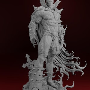 May include: A grey statue of Spawn, a comic book character. The figure is muscular, wearing a cape, chains, and spiked armour. He stands on a detailed base with skulls and a cross.