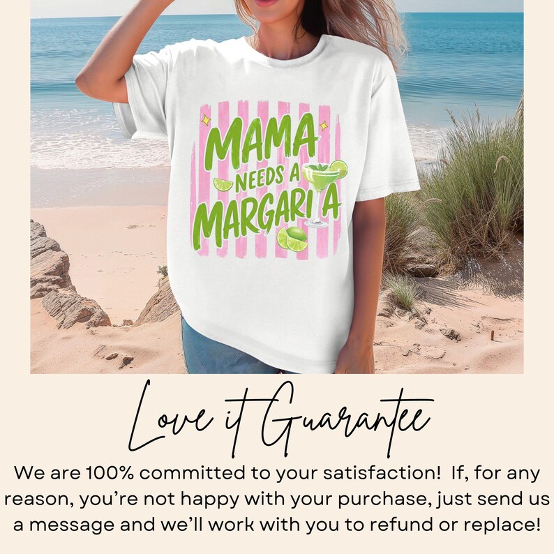 May include: White t-shirt with the text "MAMA NEEDS A MARGARITA" in green and pink. The design includes a margarita glass and lime slices. The shirt is worn by a person on a beach.
