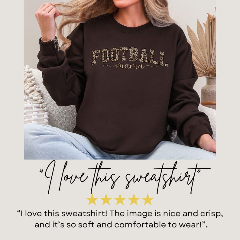 May include: A dark brown sweatshirt with the text "FOOTBALL mama" in a leopard print design. The sweatshirt is a crew neck style and is made of a soft material. The image also includes the text "I love this sweatshirt".
