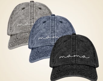 May include: Three denim baseball caps in gray, blue, and black with the word "mama" embroidered in white cursive on the front.