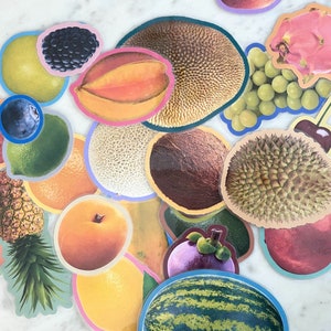 May include: A collection of colorful fruit stickers, including a pineapple, watermelon, orange, and a variety of tropical fruits.