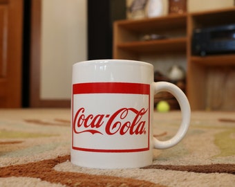 Verschiedene Coca-Cola Glas Tassen und Becher