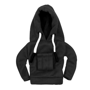 May include: A miniature black hoodie with a front pocket and a hood. The hood has white drawstrings and black tips. The hoodie is made of a soft, textured fabric.