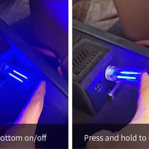 May include: A blue LED car interior light is shown in two images. The first image shows the light on, with the text "Touch bottom on/off". The second image shows the light being dimmed, with the text "Press and hold to light/dim".
