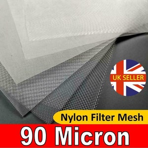 May include: A stack of white nylon filter mesh with a 90 micron pore size. The mesh is folded in half and the edges are visible. The text "Nylon Filter Mesh 90 Micron" is printed in red on a black background.