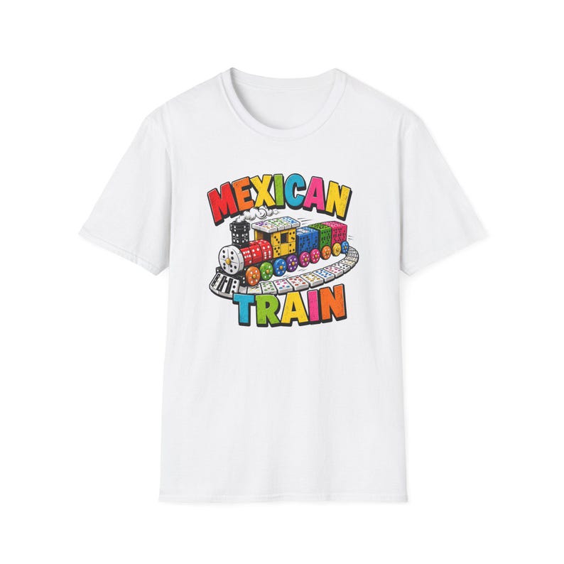 May include: A white short-sleeve t-shirt featuring a colorful graphic of a train made of dice and dominoes on a track. The text "MEXICAN TRAIN" is printed in bold, multi-colored letters above and below the train illustration on the front.