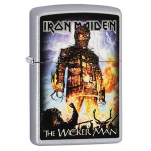 May include: Silver lighter with a colorful image of a burning wicker man, with the text "Iron Maiden" and "The Wicker Man" on the front.
