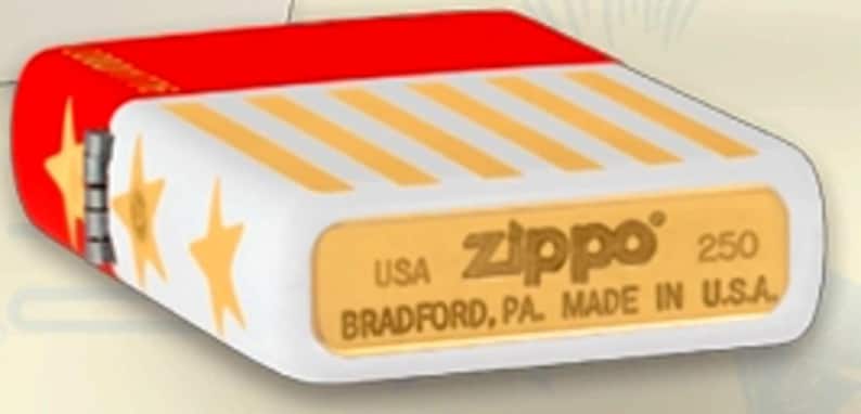May include: A white Zippo lighter with a red top and gold star accents. The lighter features diagonal gold stripes and the Zippo logo with the text "USA BRADFORD, PA. MADE IN U.S.A."